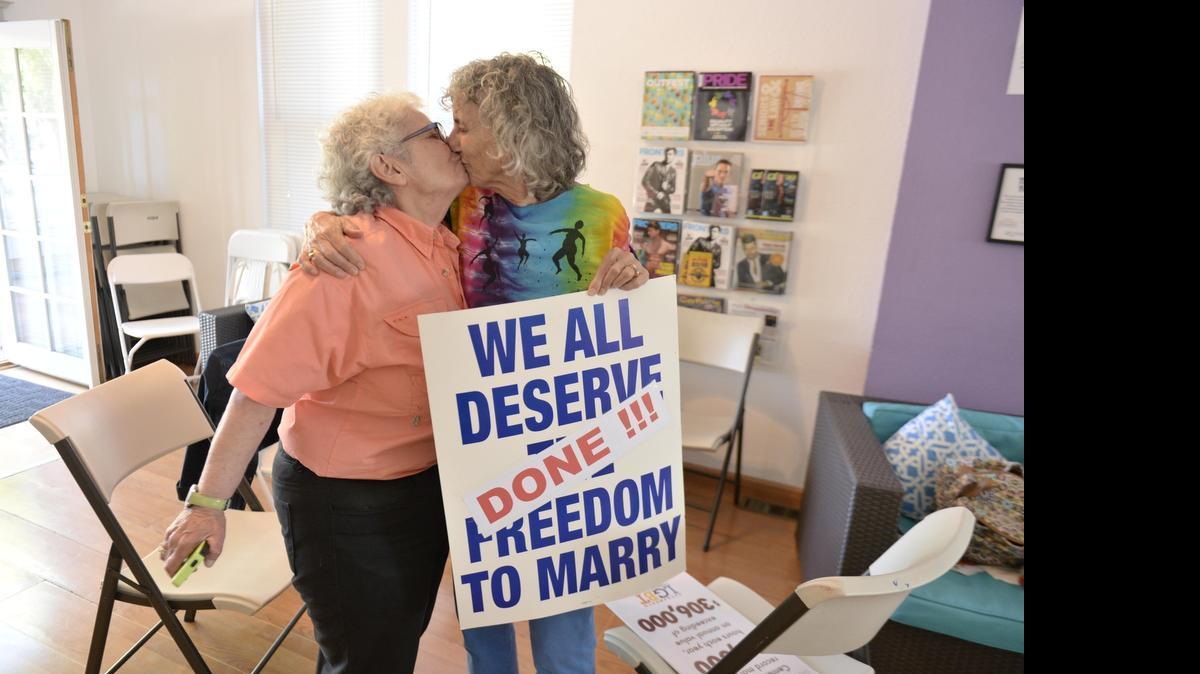 Shelly Bailes, left, and her wife Ellen Pontac celebrate at Sacramento’s LGBT Center on June 26, 2015 after the U.S. Supreme Court declared that same-sex couples have a right to marry anywhere in the US.
