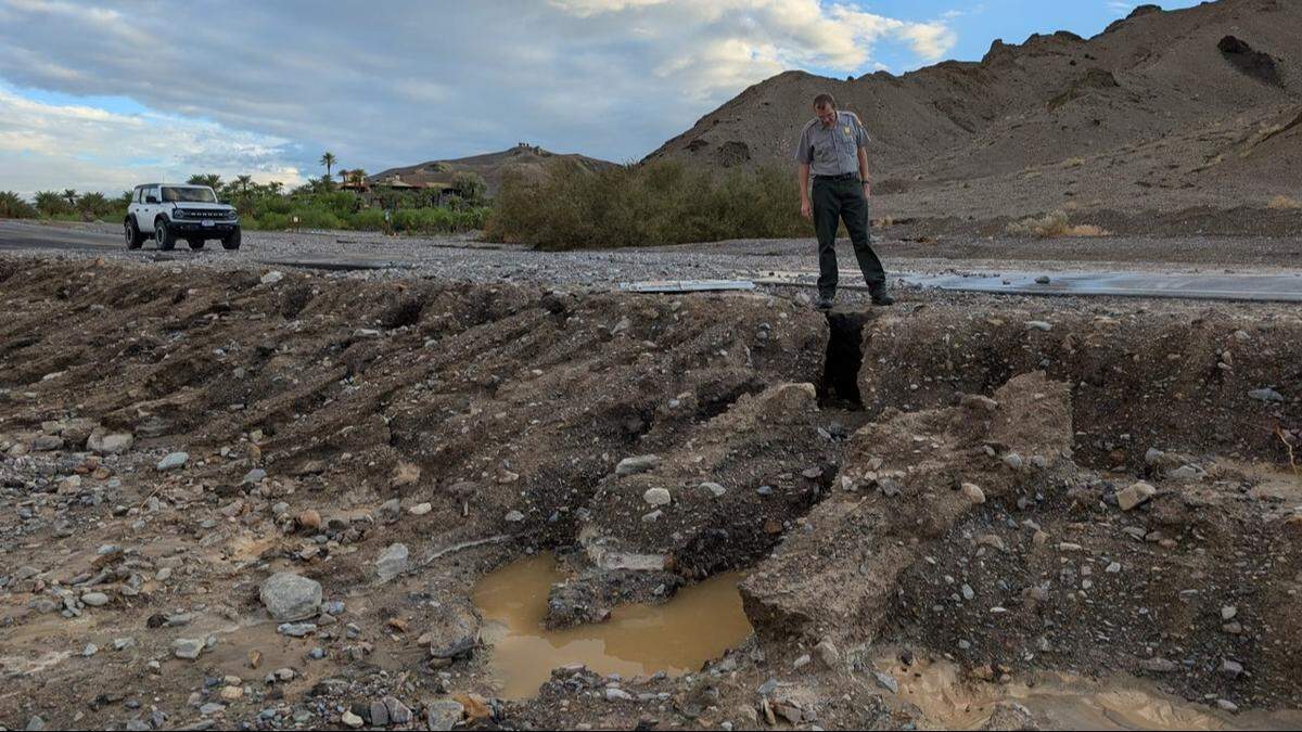 Death Valley National Park Superintendent Mike Reynolds assessing damage on Badwater Road, which was closed after the storm.