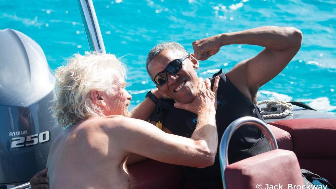 In this recent but undated photo made available by Virgin.com, former U.S President Barack Obama, jokes with Richard Branson, founder of the Virgin Group, during his stay on Moskito Island, British Virgin Islands. The former president and his wife stayed on Mosikto Island owned by Richard Branson, founder of the Virgin Group, after he finished his second term as President and left the White House.