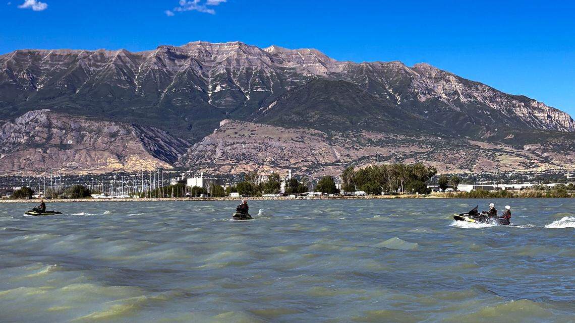 Rescuers searched choppy waters on a Utah lake after a 23-year-old vanished while riding a jet ski with his cousin.