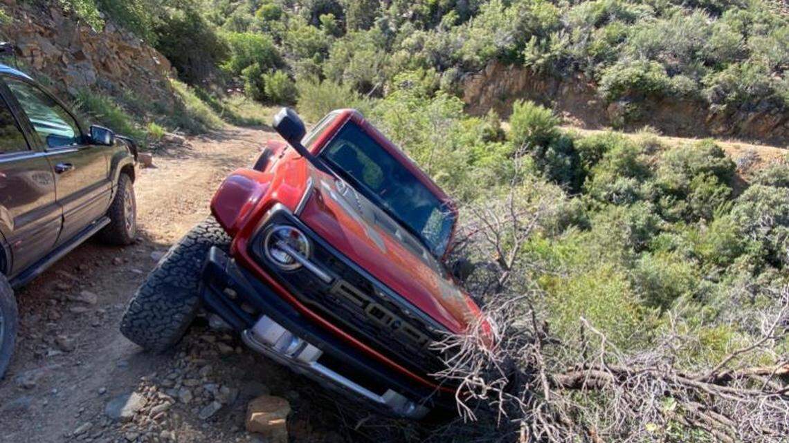 A 74-year-old and his two dogs were stranded in Arizona’s mountains after the Ford Bronco he was driving slid off the road, rescuers said.