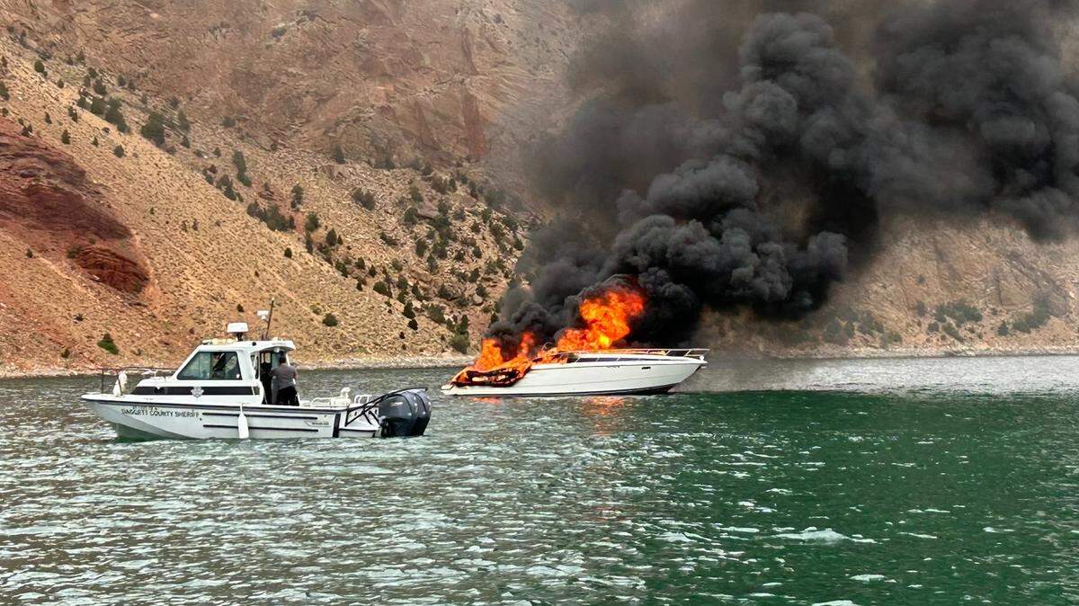 The boater first tried to extinguish the flames on the vessel at Flaming Gorge Reservoir.