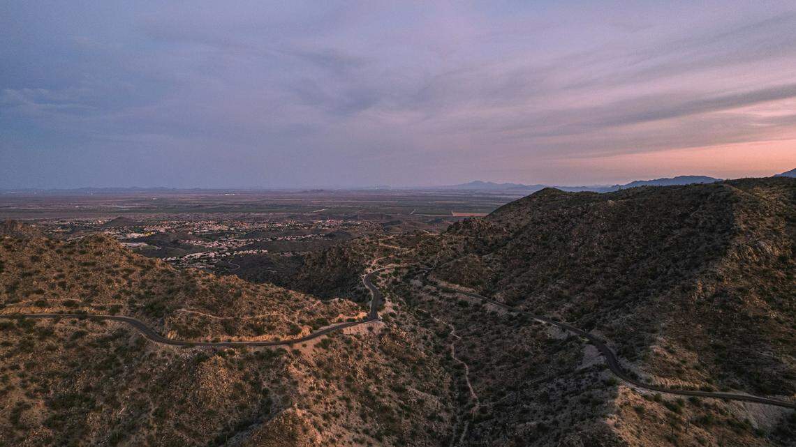 A hiker fell up to 70 feet from the top of a mountain in Arizona, rescuers said.