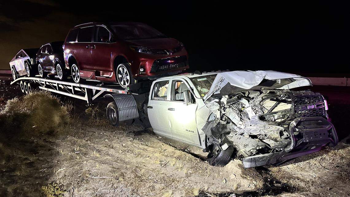 The wrecked truck is pictured with three vehicles on its trailer in Buckeye, Arizona.