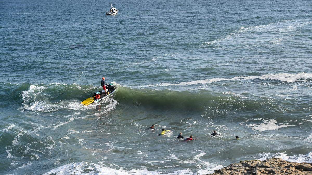 Searchers from several agencies looked for the missing swimmer using drones, aircraft and boats, firefighters said.