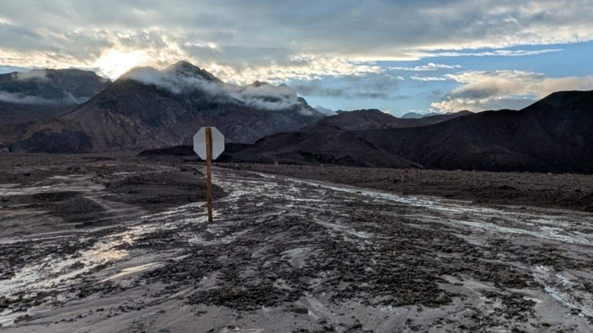 Debris covers Artist Drive after rainfall from the remnants of Tropical Storm Mario.