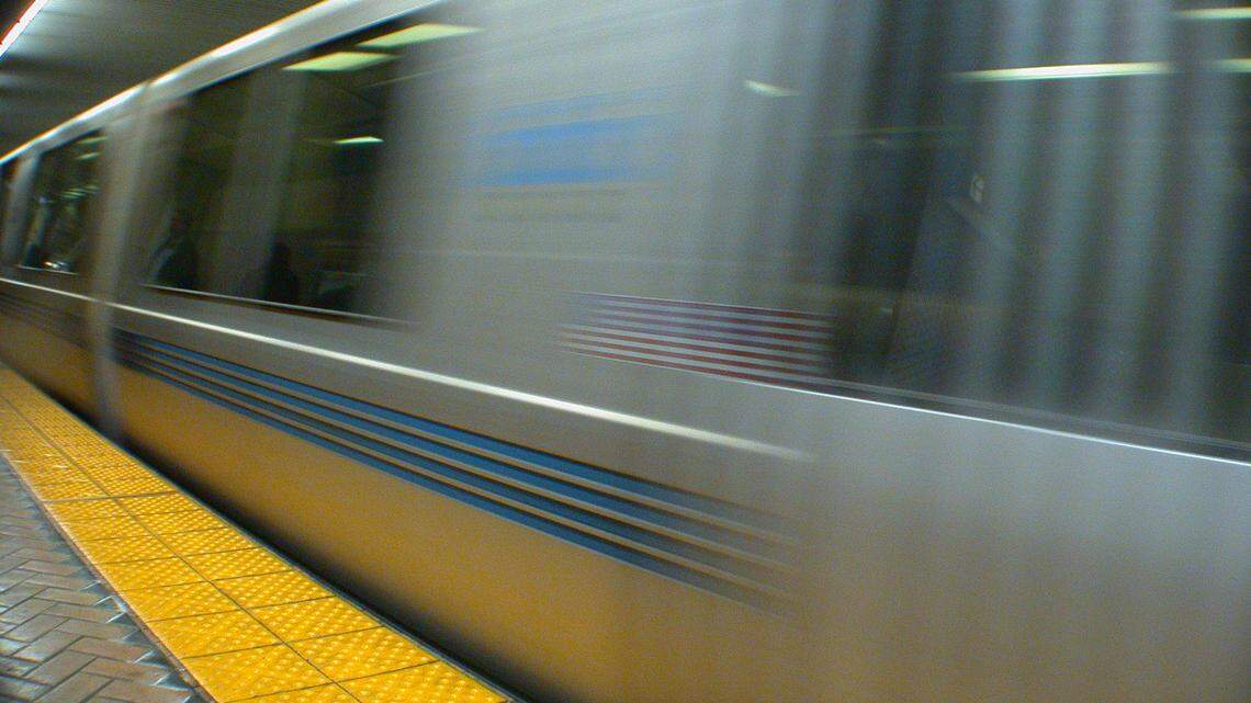 A man is accused of shoving a 74-year-old woman into a passing Bay Area Rapid Transit train, killing her, California police say.