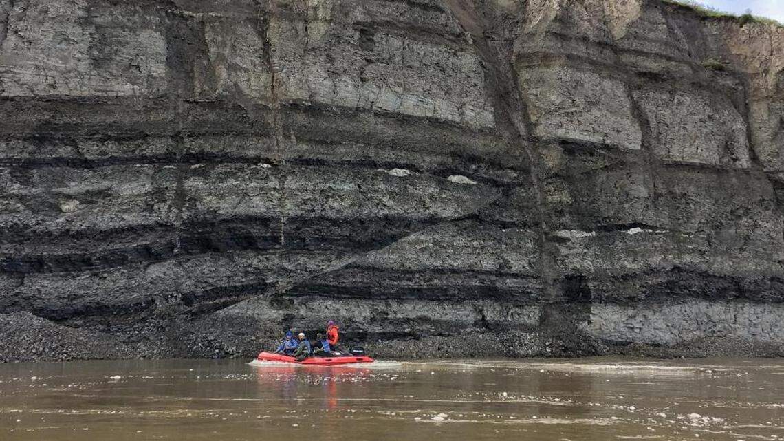 Researchers are seen in a boat on the Colville River.