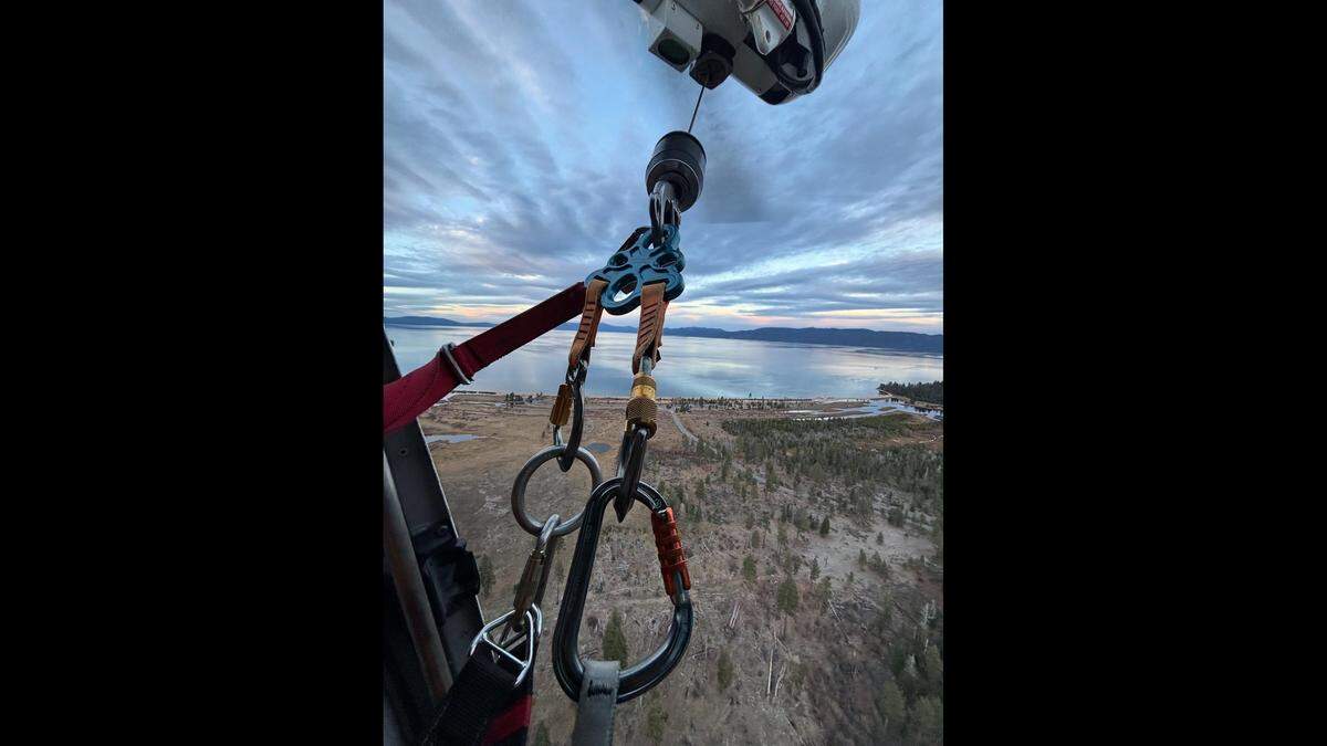 A California Highway Patrol helicopter hoisted a climber stranded on a ledge near Lake Tahoe to safety, rescuers said.
