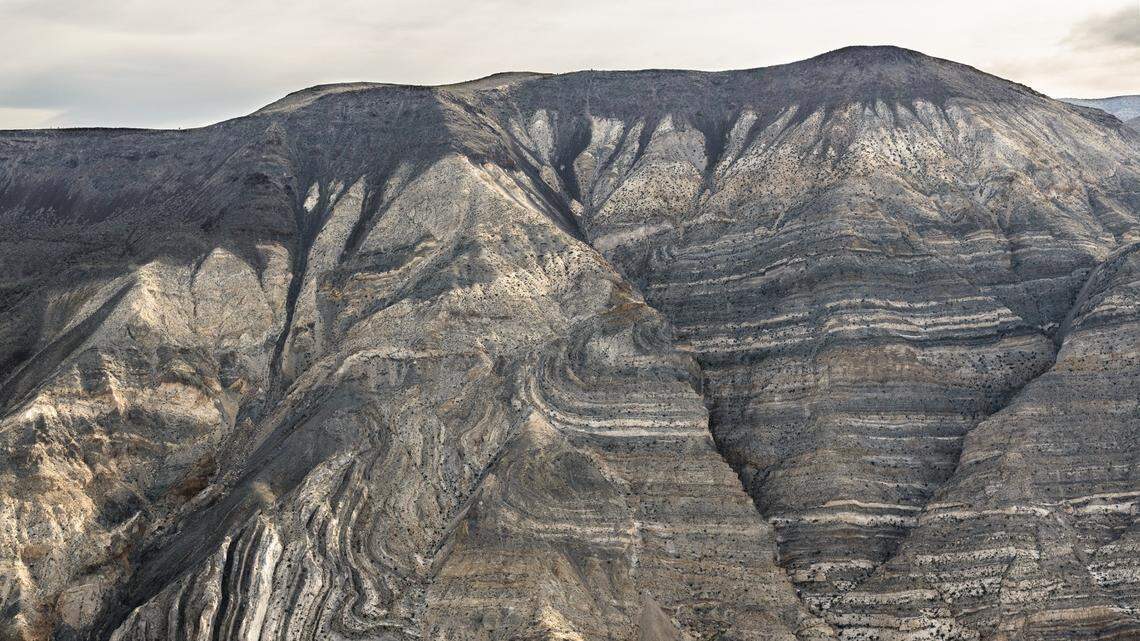 A resort worker collapsed and fell down a scree after running out of water on a scorching Death Valley hike, rangers say.