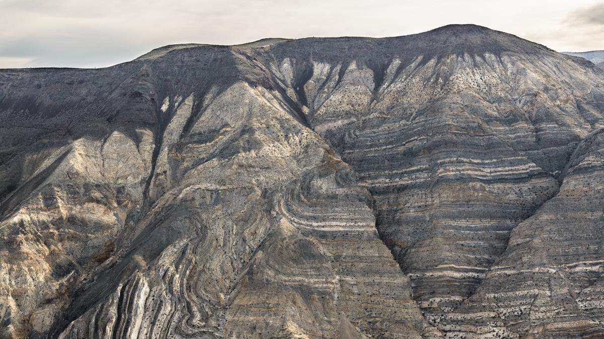A resort worker collapsed and fell down a scree after running out of water on a scorching Death Valley hike, rangers say.