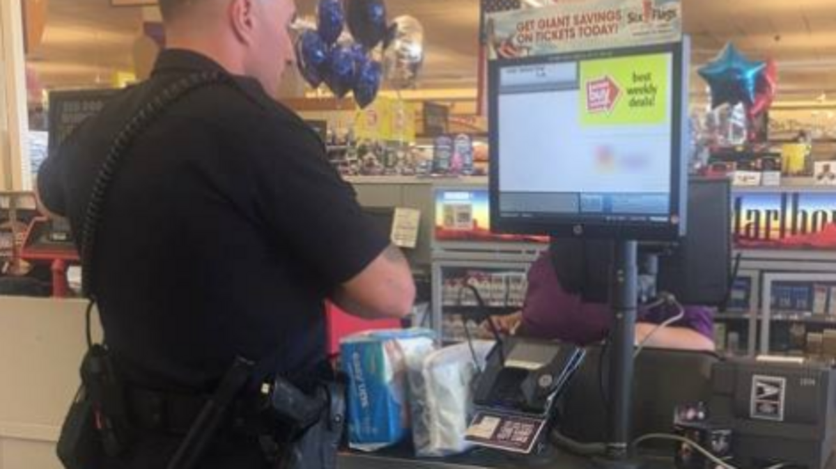 Officer Bennett Johns purchases diapers at a Laurel, Maryland, supermarket for a 20-year-old mother who had been caught trying to steal the diapers for her newborn when she couldn’t afford them after buying food. The woman was still cited for shoplifting, police said.