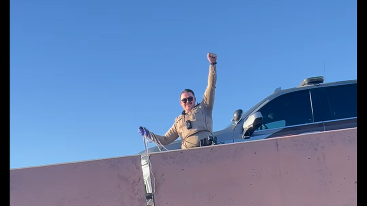 The kitten was rescued after troopers responded to a call about a man in need of help near a freeway, the Arizona Department of Safety said.
