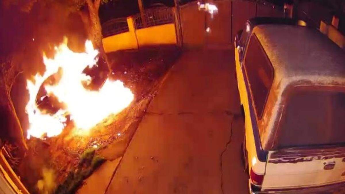 A review of doorbell camera video showed an arsonist set the vehicle and then himself on fire, firefighters said.