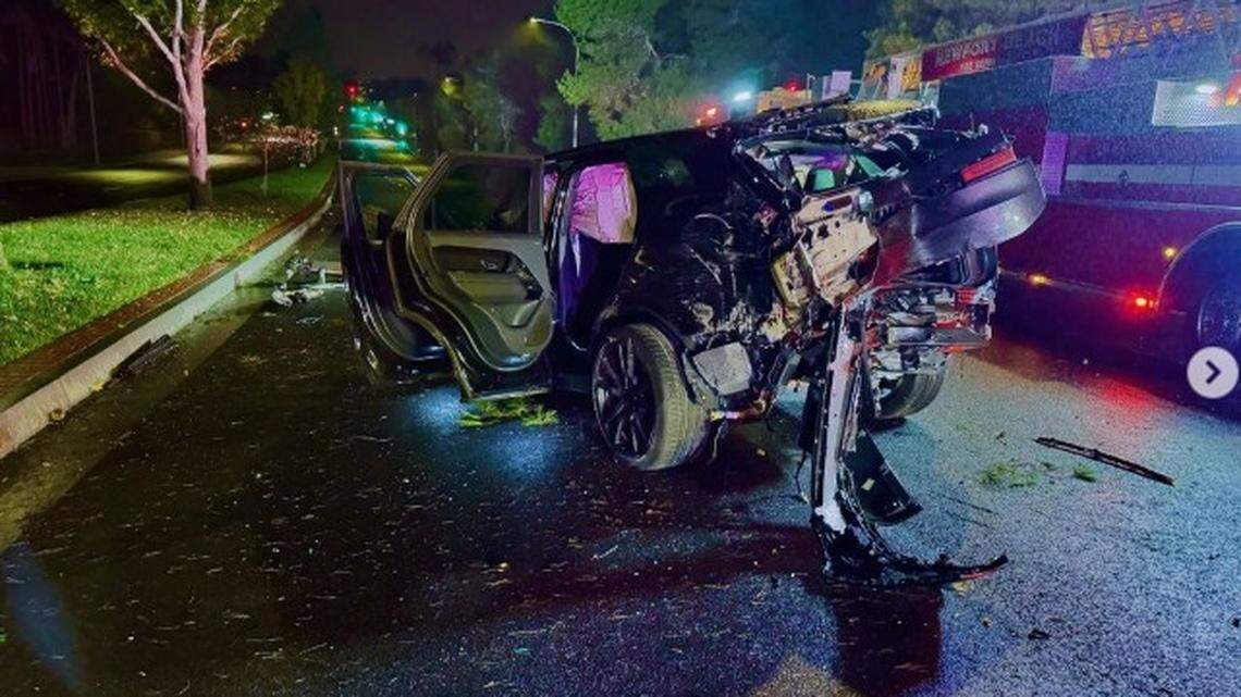 The two occupants of the wrecked SUV were found sitting on the curb, firefighters say.