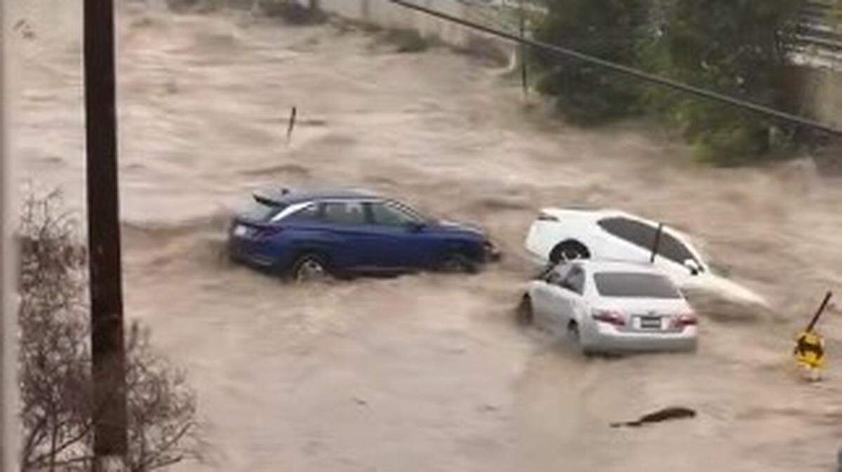 Heavy rain causes flash floods in San Diego that sweep away vehicles and inundate homes, online videos show.