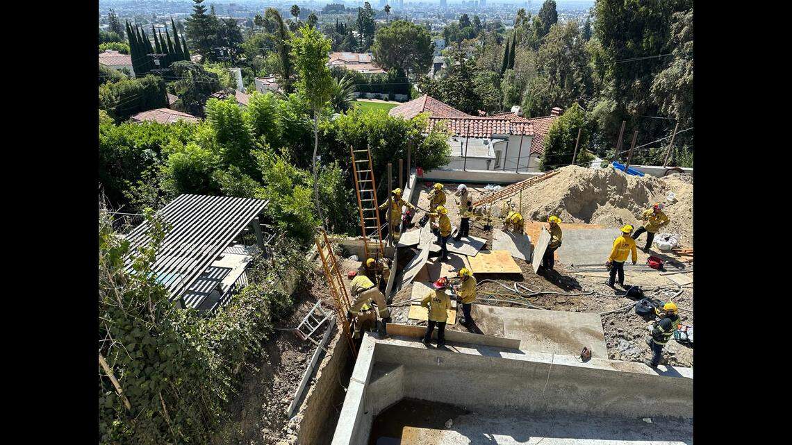 The trapped worker was “conscious and alert,” rescuers said.