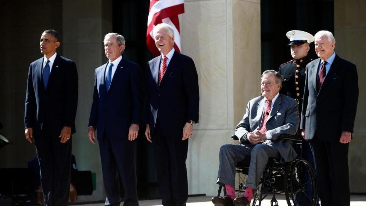 President Barack Obama, left, is in attendance with former presidents George W. Bush, Bill Clinton, George H.W. Bush, sitting, and Jimmy Carter, right, at the dedication of the George W. Bush presidential library at Southern Methodist University in Dallas on April 25, 2013.