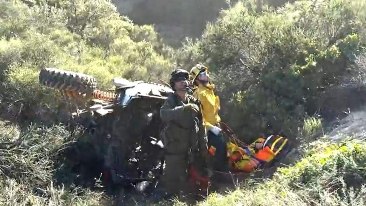 Four people were riding in an all-terrain vehicle on a dirt road when it plugged 30 to 40 feet down a canyon, rescuers say.