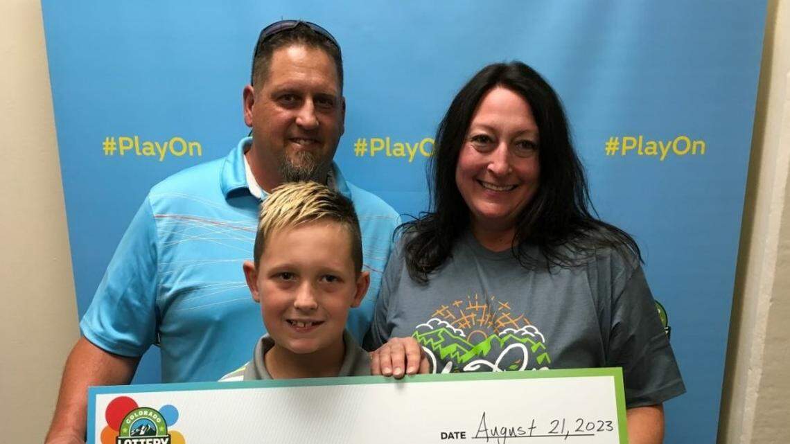A woman found out she’d won big after lottery officials showed up to her home with a big check, Colorado officials said.