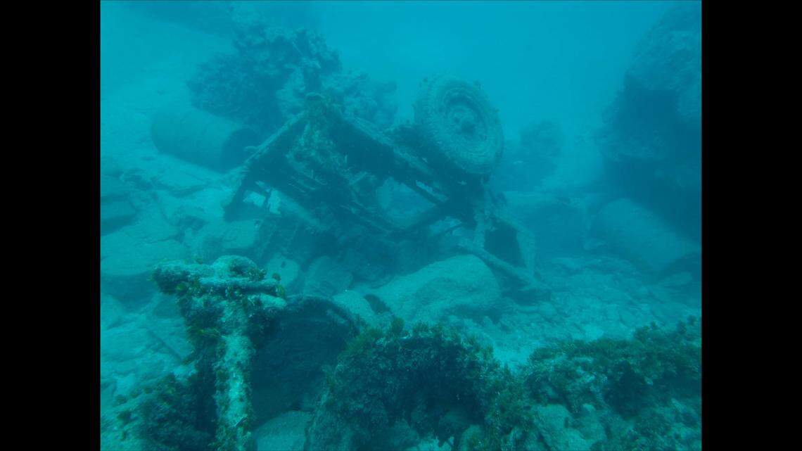 Among the strangest of the discoveries made by the team was a sunken Jeep trailer, fully loaded with equipment and weapons — including of​ crates of unexploded ordnance.