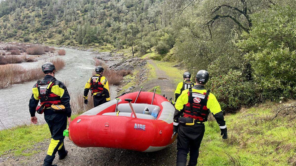 Search and rescue team members prepare to boat on the river in  Auburn State Recreation Area on Saturday, Jan. 3, 2026. Authorities are continuing to search for a woman reported missing Friday afternoon on the Codfish Falls Trail after her dog was found alone and her belongings were discovered near the river.