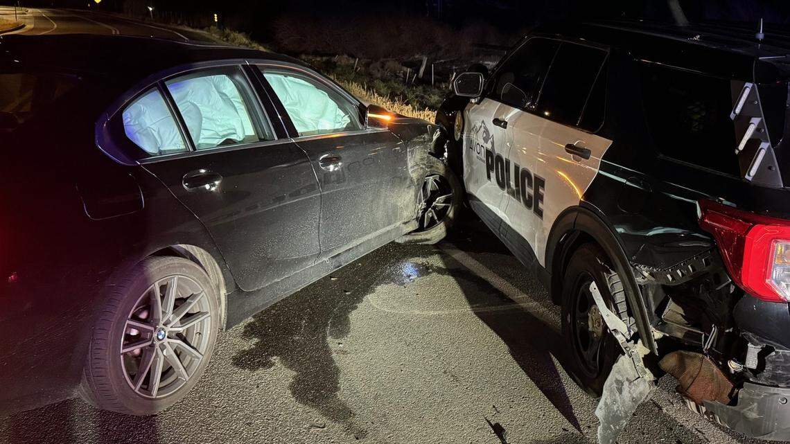 The officer was in his vehicle checking a license plate after a traffic stop when another driver slammed into him, police say.