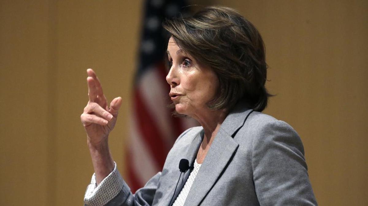 House Minority Leader Nancy Pelosi of California speaks during a town hall-style meeting Feb. 1 at the Cambridge Public Library, in Cambridge, Mass. At a similar meeting Tuesday in Arizona, Pelosi was heckled by a woman who demanded to know her net worth after Pelosi attacked recent tax cut legislation.