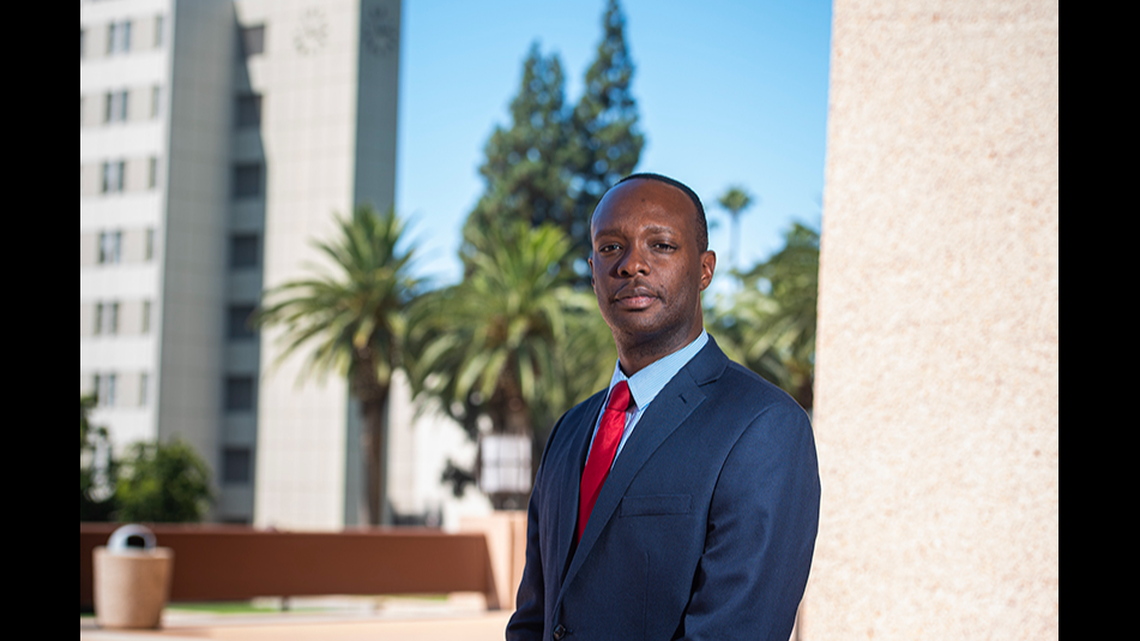 Two men have been charged after a man was “executed” as he dined alone at the counter of a California restaurant, prosecutors said.