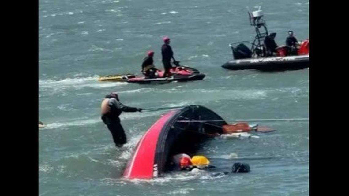 Another boat tried to tow the sailboat, which flipped onto its side, the Coast Guard said.