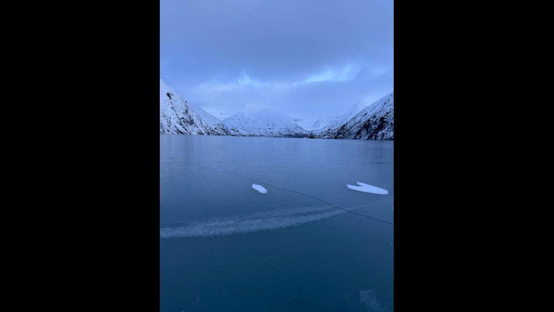 Two people became stranded after a piece of glacier broke off onto Portage Lake in Alaska, officials said.