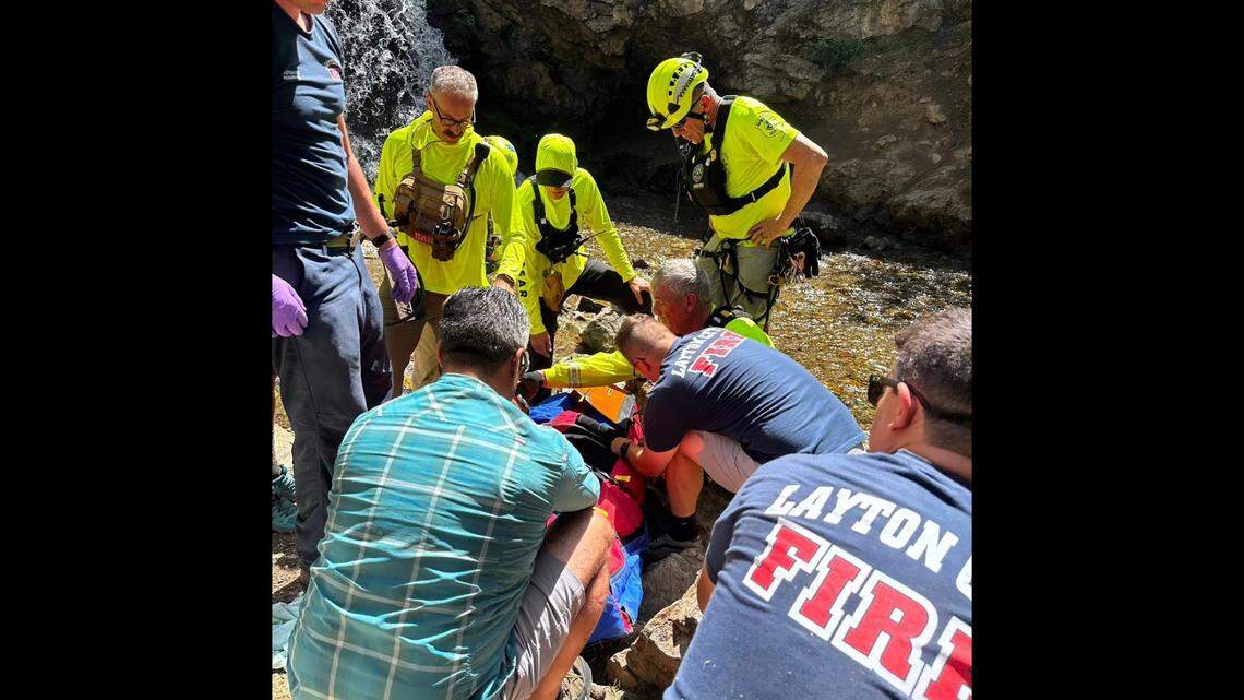 Bystanders and rescuers helped a hiker who fell more than 20 feet from a slippery Utah waterfall, officials said.