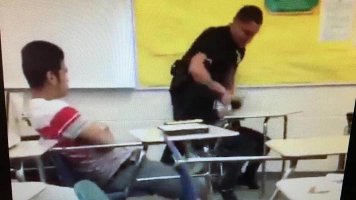 In this frame captured from a Tweeted video, Richland County Sheriff’s senior deputy Ben Fields, a school resource officer at Spring Vally High School, can be seen pulling a student to the floor.