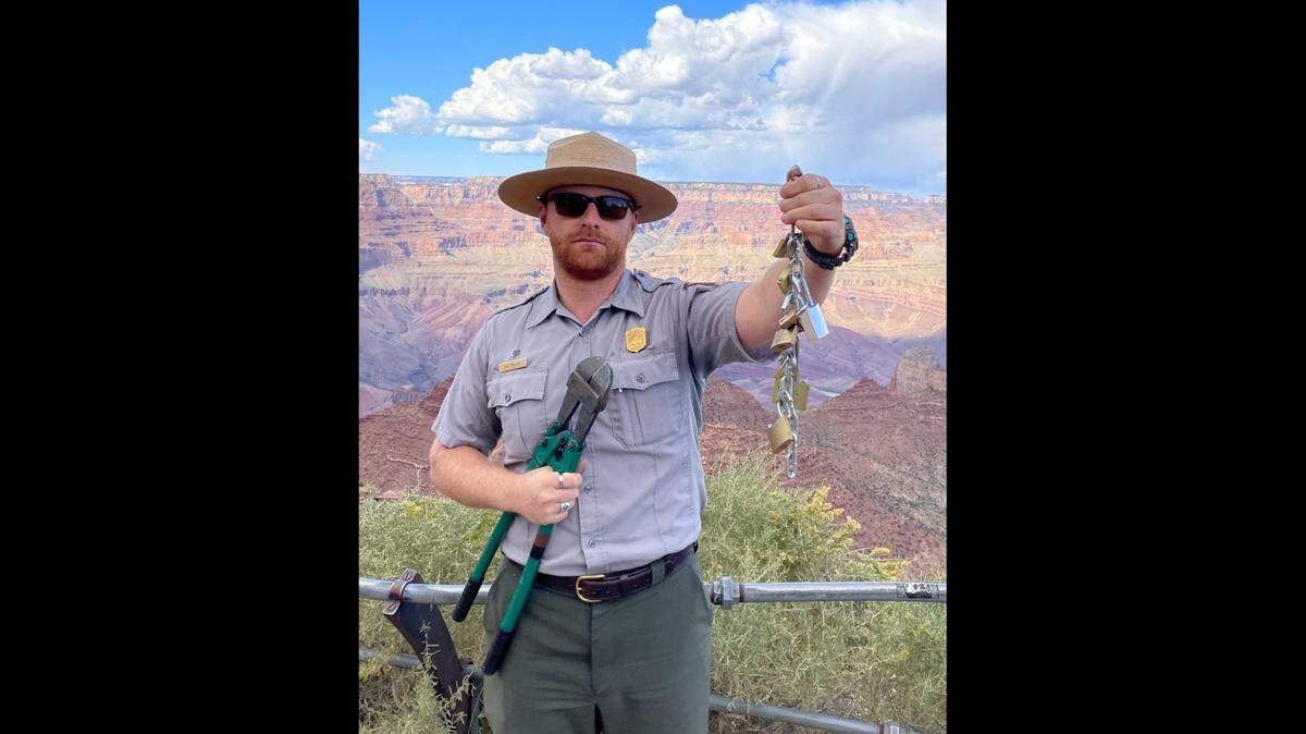 Park officials warn visitors against adding padlocks to fencing at the Grand Canyon and throwing the key into the canyon.