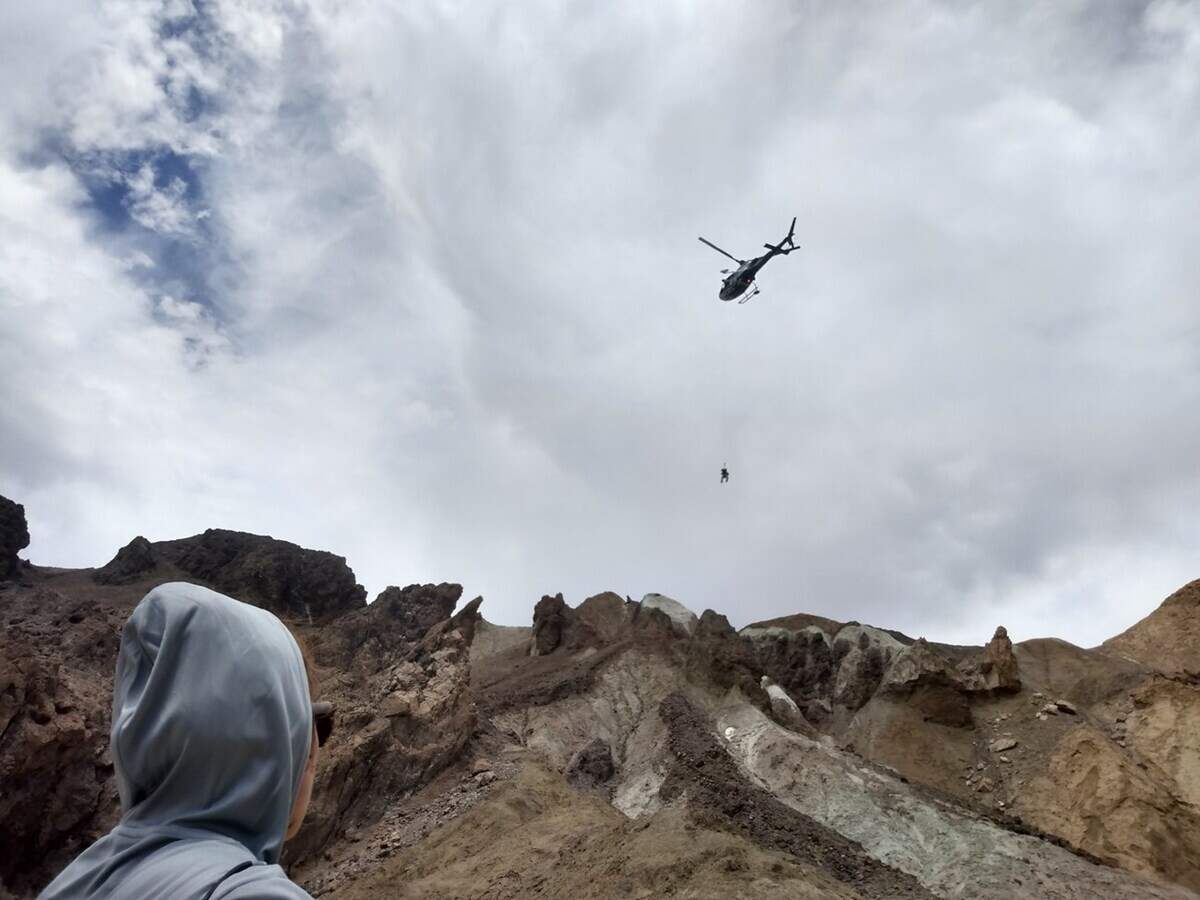 Park rangers were able to communicate with her but couldn’t find a safe way to get to her, officials said. Eventually a California Highway Patrol helicopter hoisted her from the ridge.
