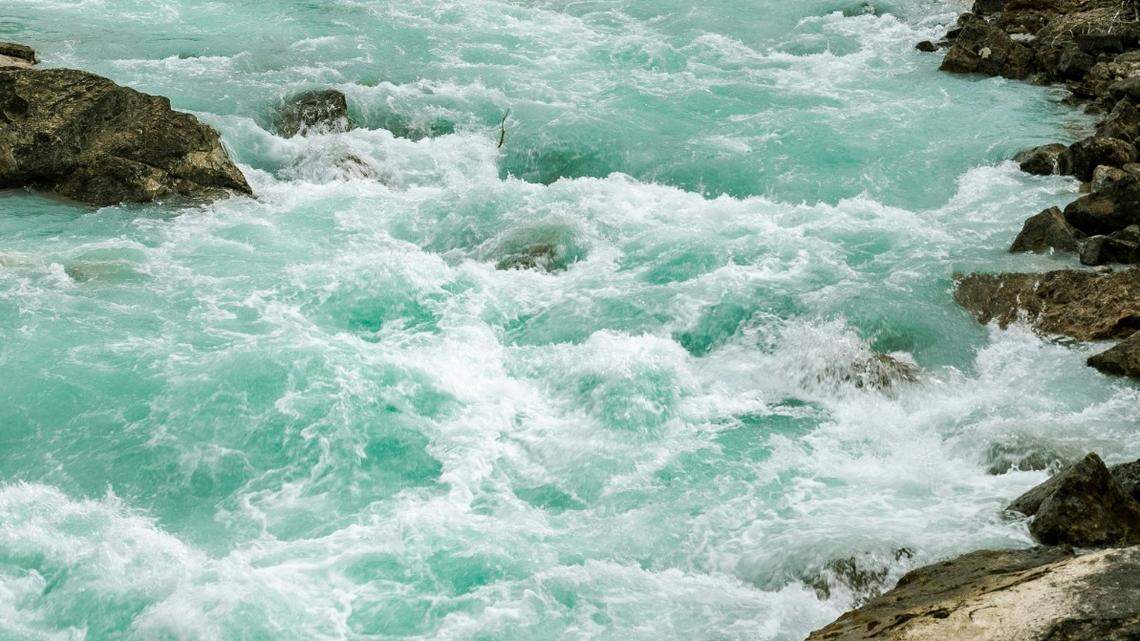 The man had been swept away from shore and pulled underwater by swift currents while fishing with his family, deputies said.