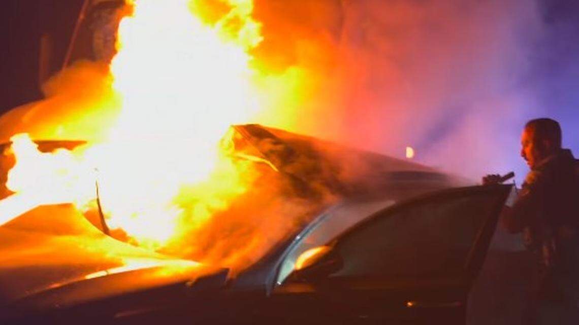 A stolen car collided with a big rig and caught fire on a Long Beach highway, according to police and video.