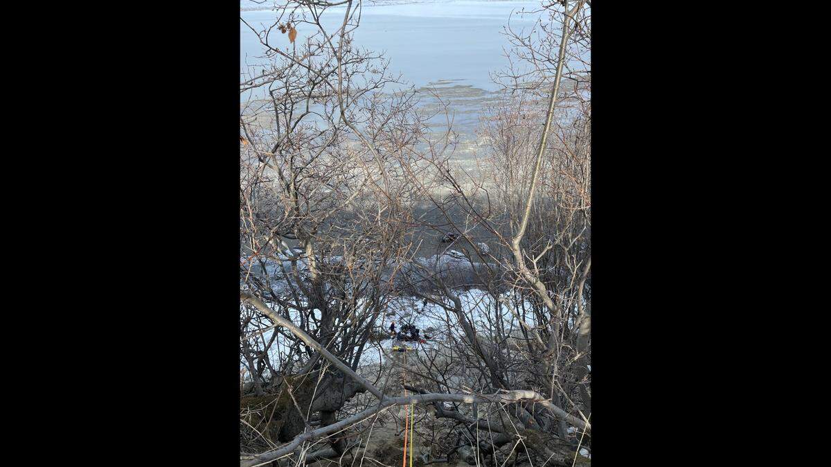A hiker tumbled over a coastal cliff edge while looking for his missing dog in Alaska, rescuers said.