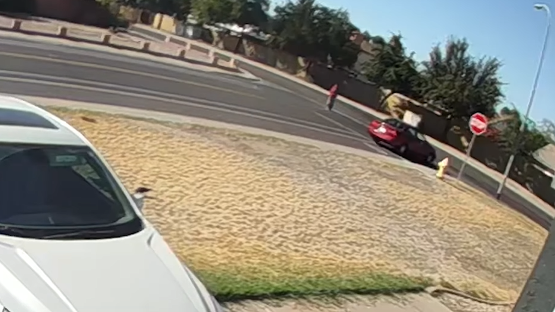 A man is seen in a red vehicle stopping a 14-year-old girl to ask for her number in Glendale, Arizona, police said.