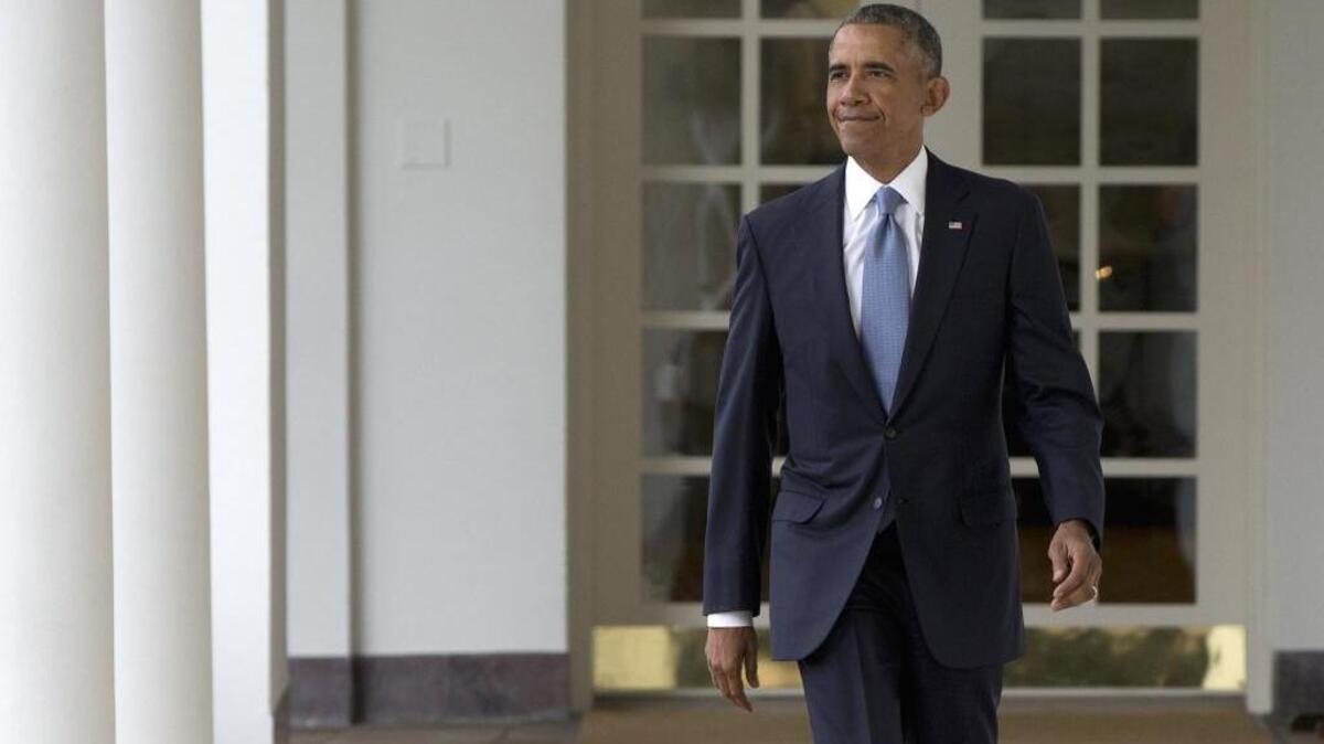 President Barack Obama walks along the colonnade of the White House in Washington, Tuesday, Jan. 12, 2016, to the residence from the Oval Office, hours before giving his State of the Union address.