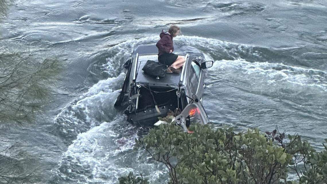 A woman was rescued after her SUV crashed into a rushing river, California officials said.