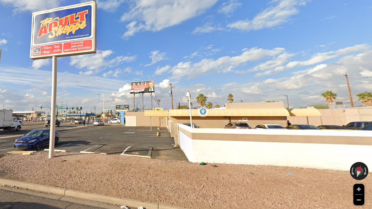 The Adult Shoppe in Phoenix is pictured. A dad is accused of leaving his kids in a hot car near the business, police said.