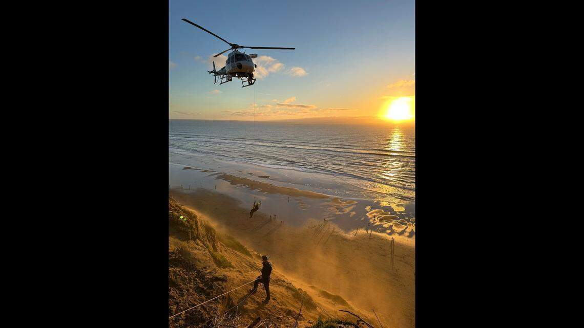A helicopter helps rescue a 12-year-old boy who became stranded on a cliff overlooking the Pacific Ocean in San Francisco.