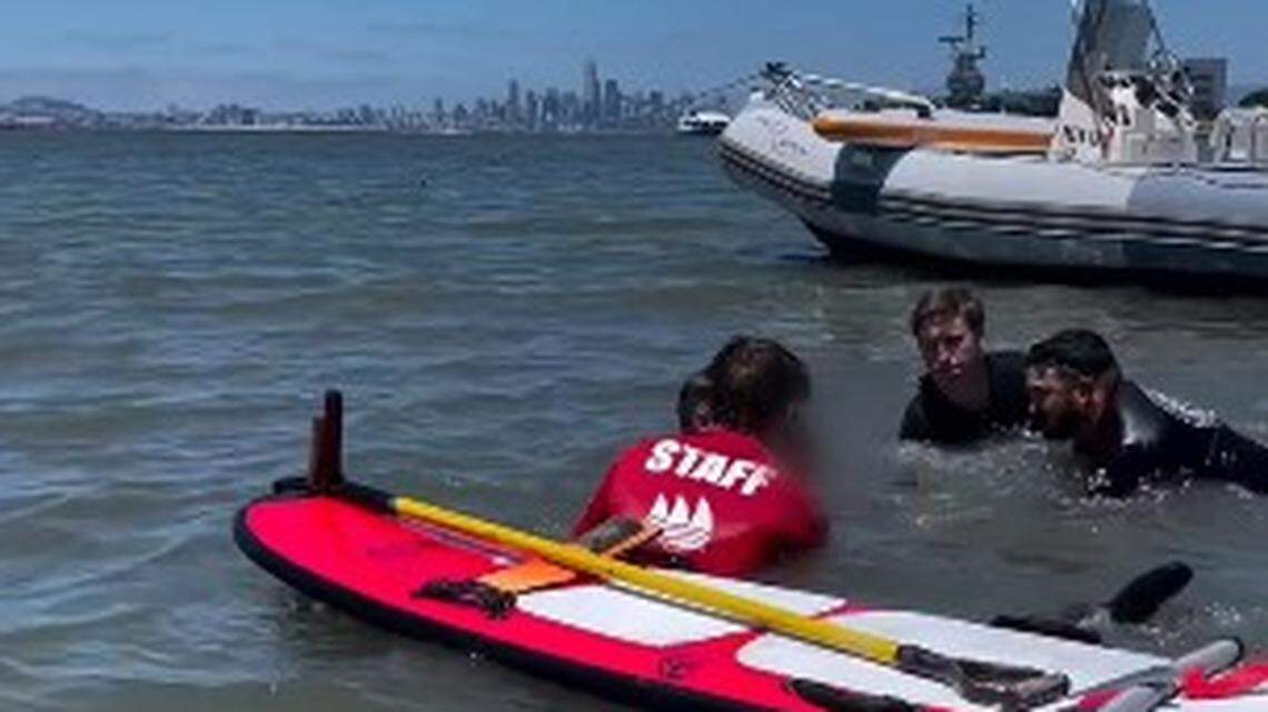 Rescuers work to save a teen stuck in rising tide on a beach near a California boat ramp.