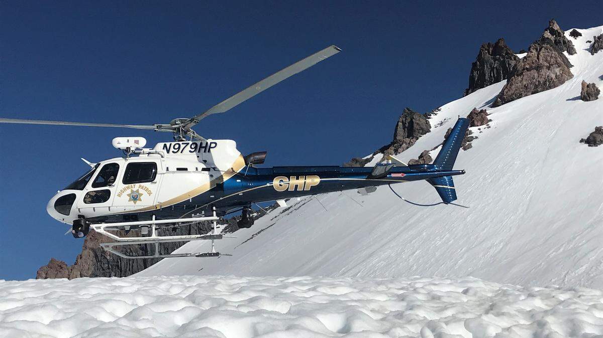 A California Highway Patrol helicopter helped rescue a man who tumbled hundreds of feet down Mount Shasta after losing an ice ax while glissading, or sliding down a snowy slope, rangers say.