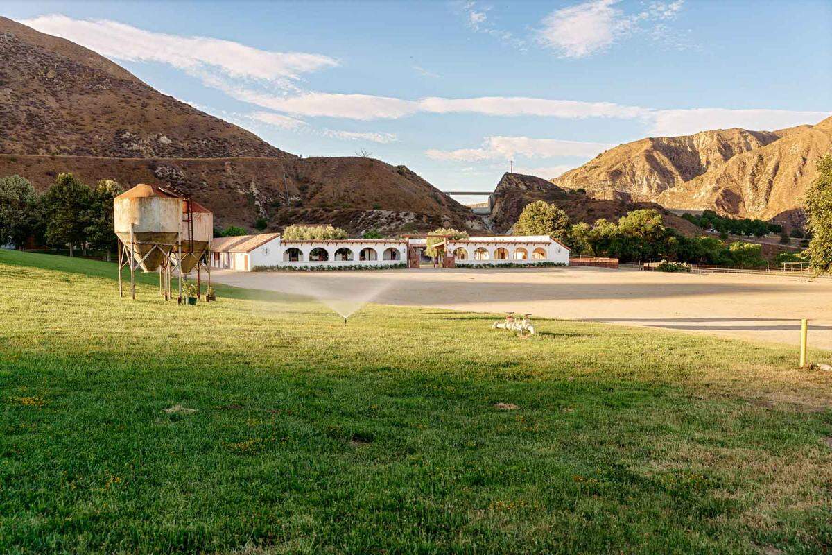 The property comes with a mission-shaped hacienda at a working equestrian facility.