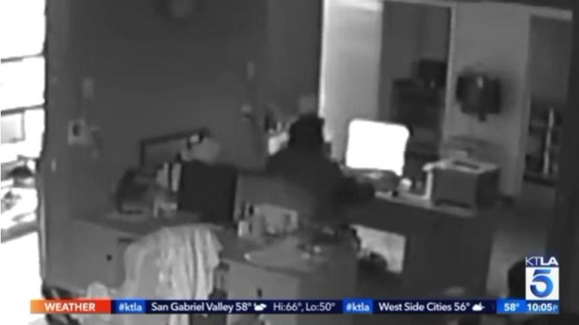 Surveillance video shows a homeless man breaking into a hair extension shop and watching porn on a computer before being interrupted Monday night by the owner, who came downstairs to make some tea, reported Los Angeles police.