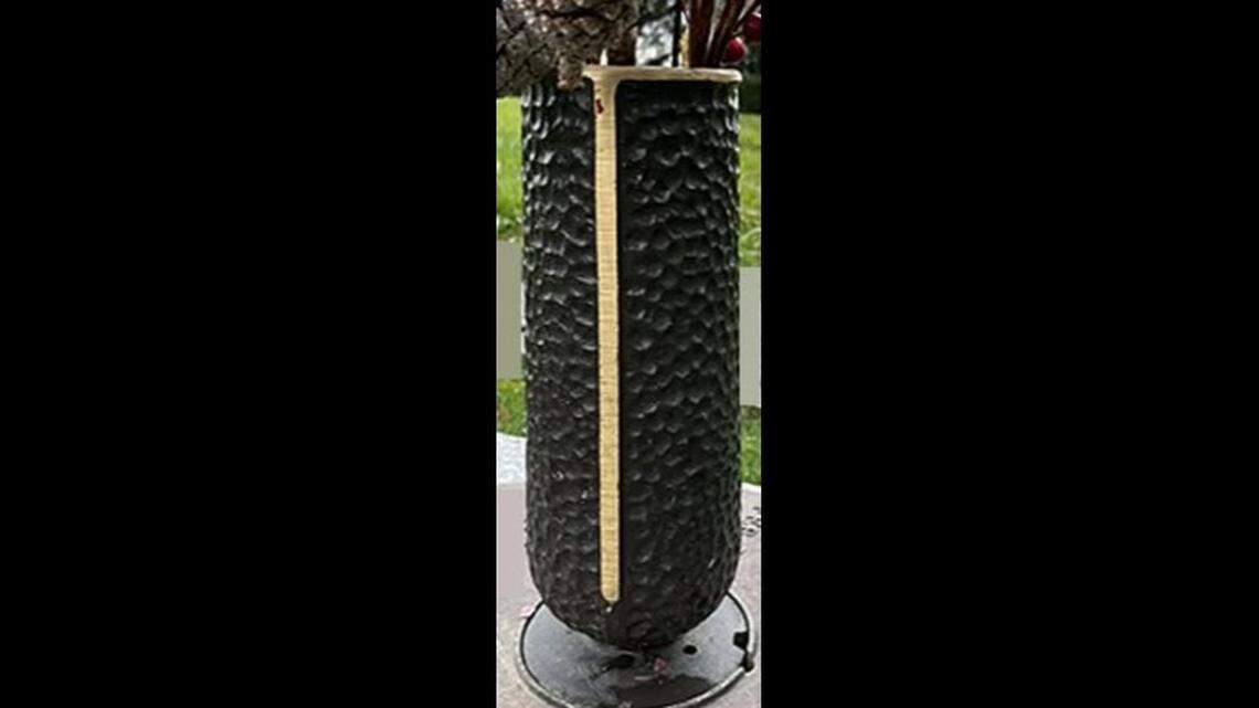 The vases had been secured to the graves, deputies said. A memorial bench at the cemetery also was vandalized.