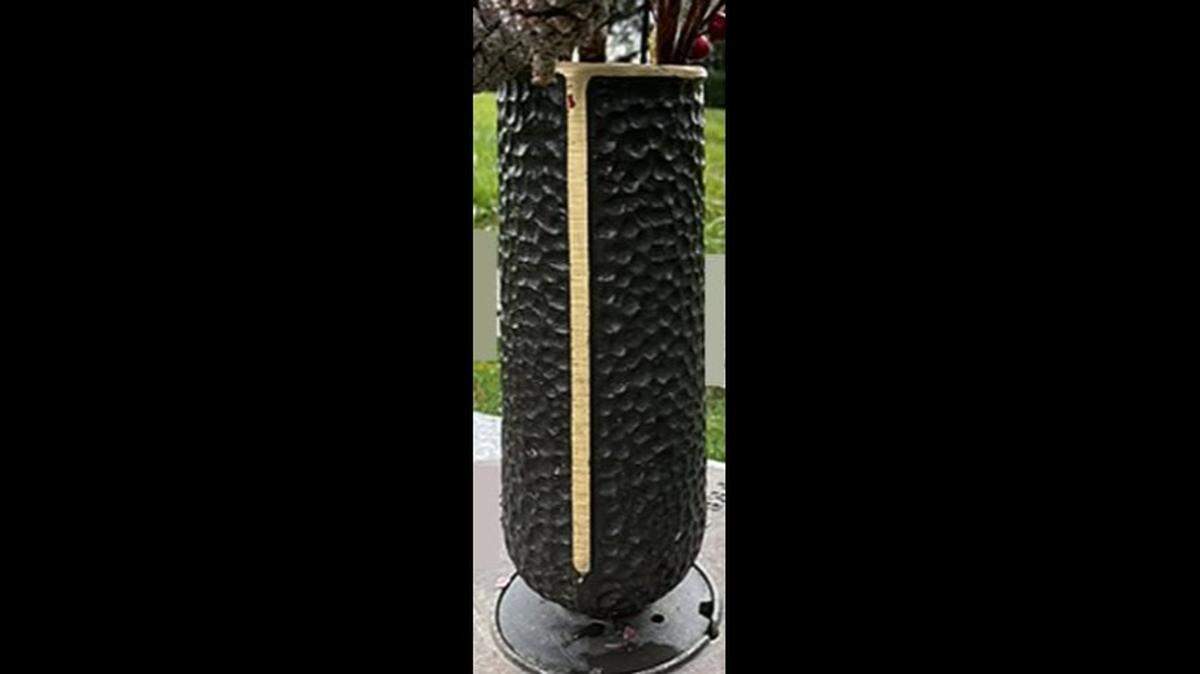 The vases had been secured to the graves, deputies said. A memorial bench at the cemetery also was vandalized.