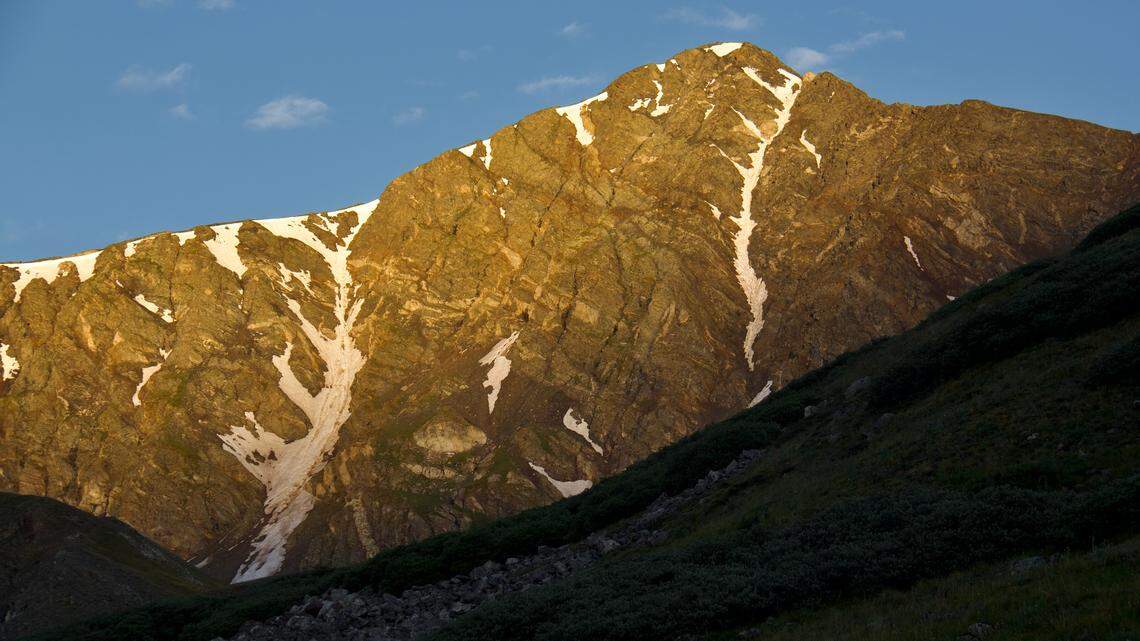 Two hikers were hoisted off a mountain peak in a record-breaking rescue, Colorado officials said.